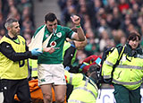 Robbie Henshaw is helped off the field after suffering a shoulder injury against Italy