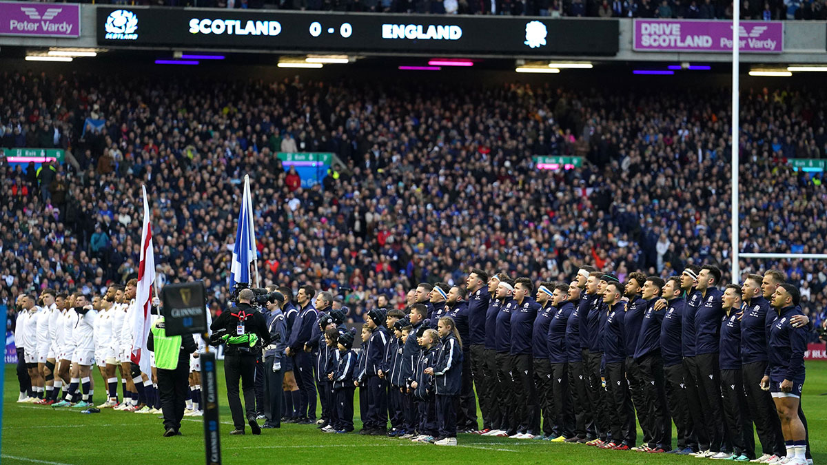 Scotland and England players line up at Murrayfield before Calcutta Cup match in 2024 Six Nations