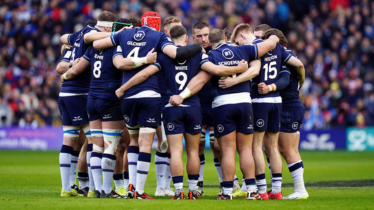 Scotland players in a huddle during match against France in 2024 Six Nations